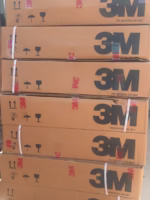 3M industrial adhesive tape boxes stacked for packaging or shipping.